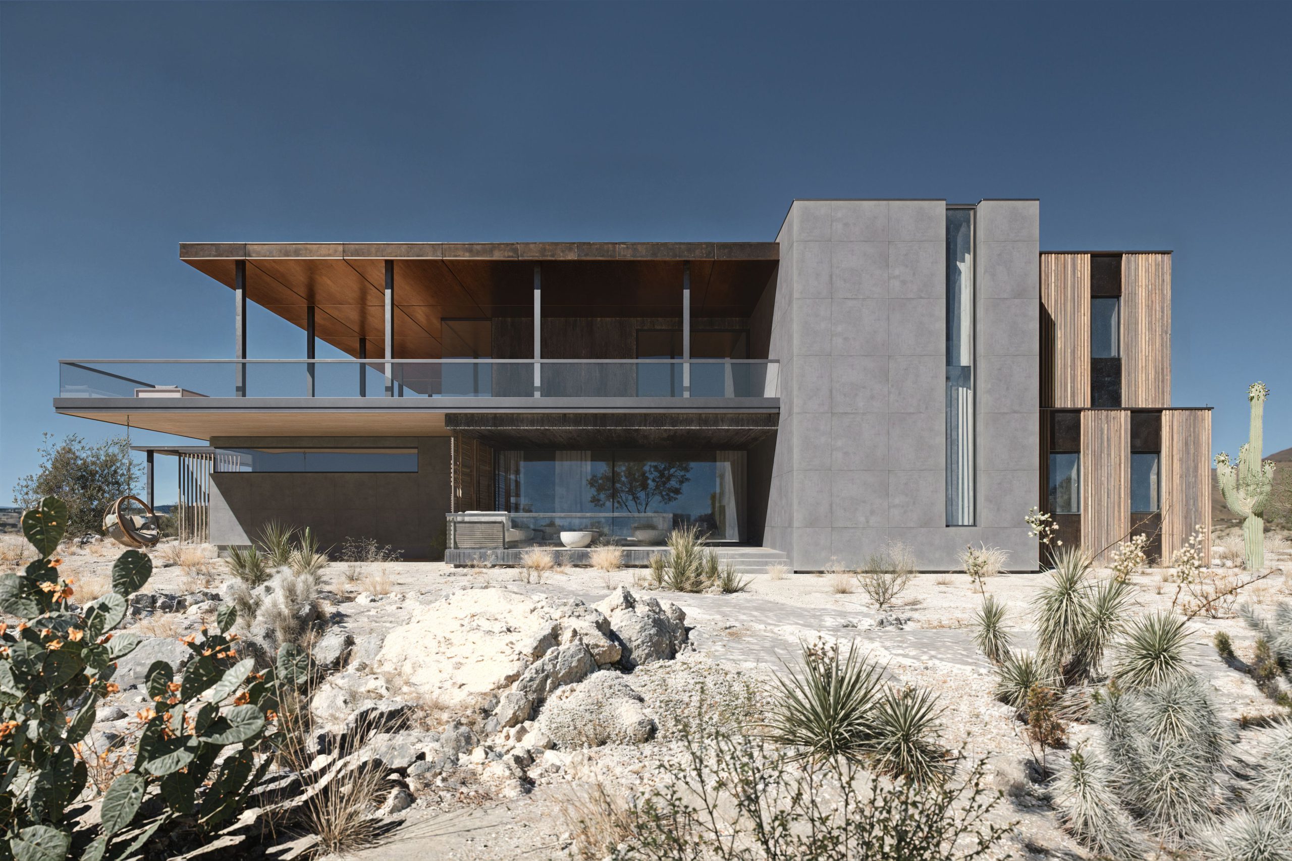 Product Rendering of Contemporary House with Stone Panels in Desert Landscape