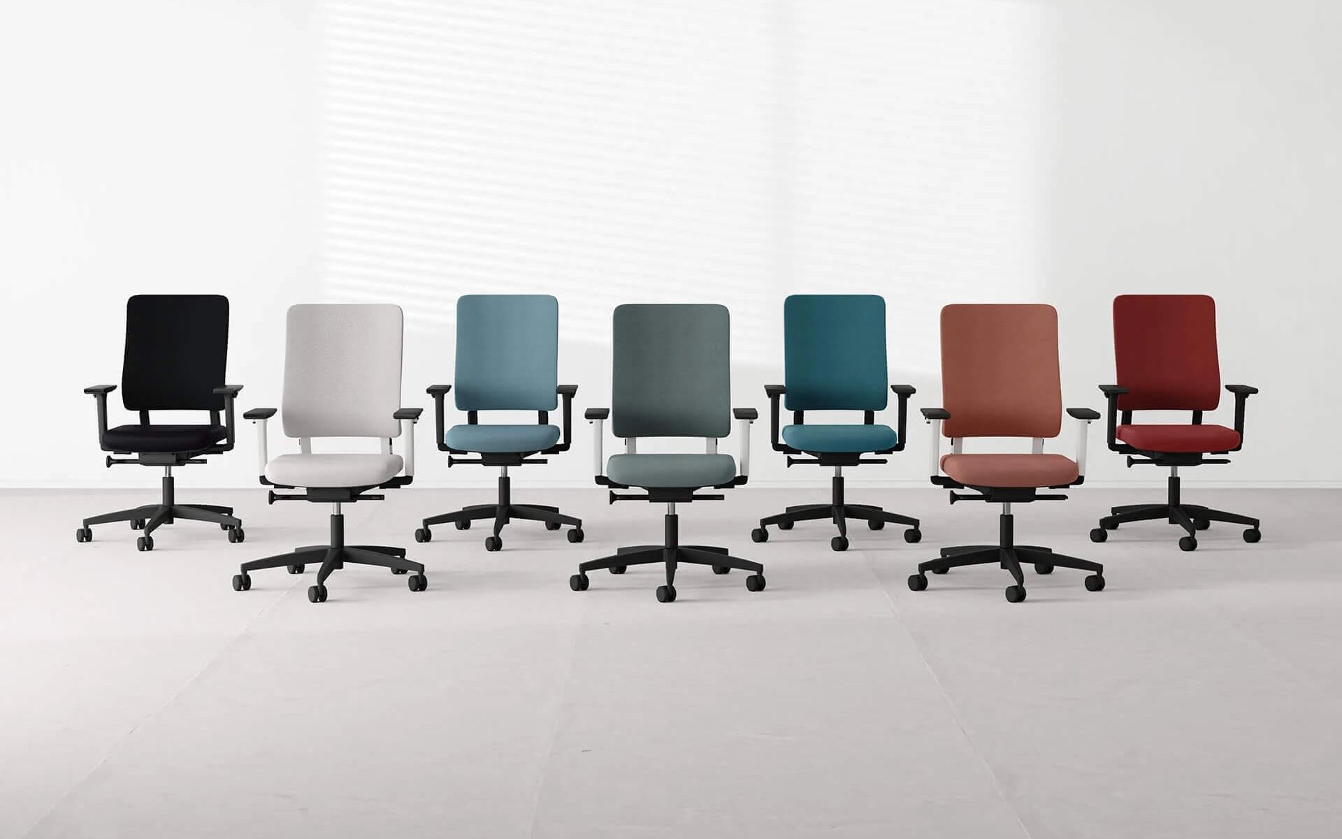 3D render of office furniture showing a row of ergonomic chairs in different colors